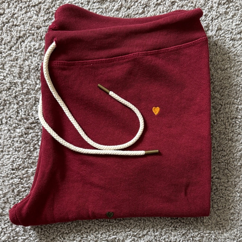 THE GREAT. Burgundy Track Joggers with Drawstring and Heart Accents